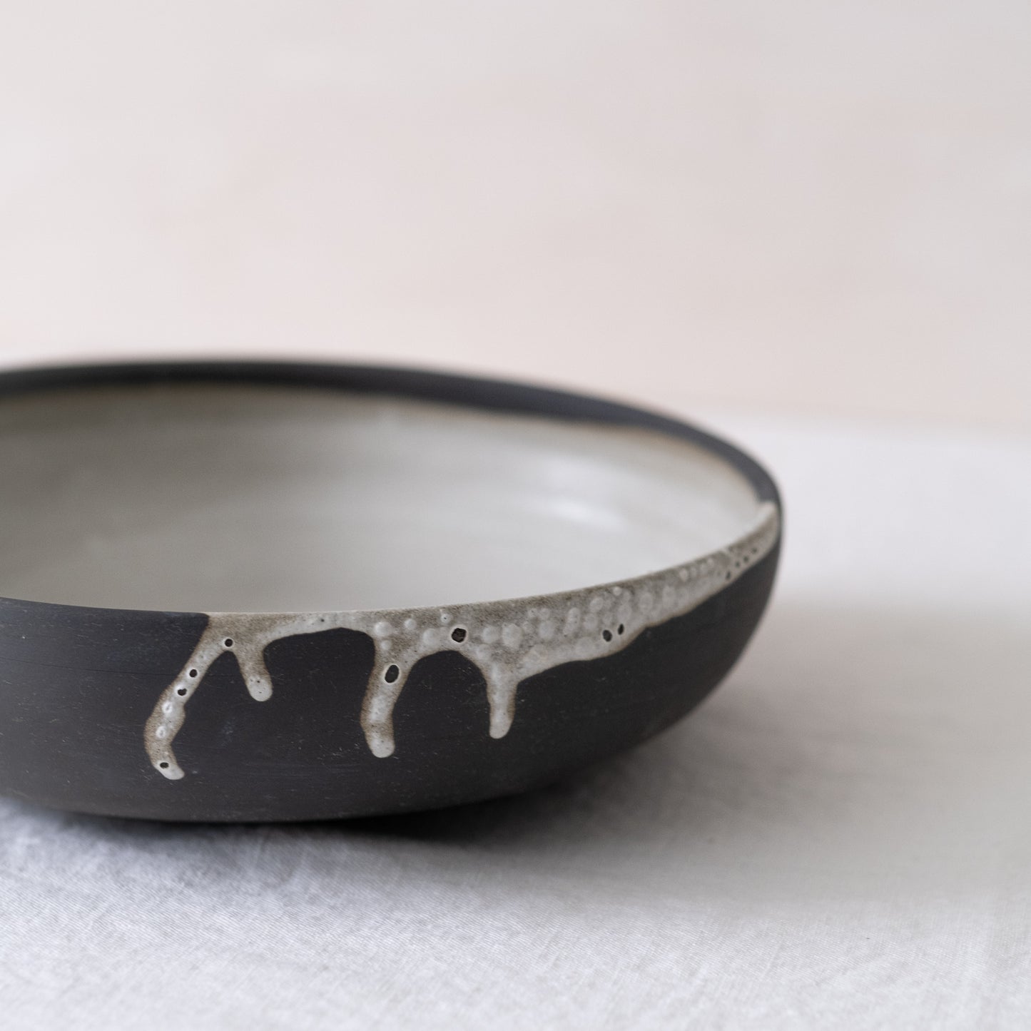 Black Serving Bowl With White Glazed Interior