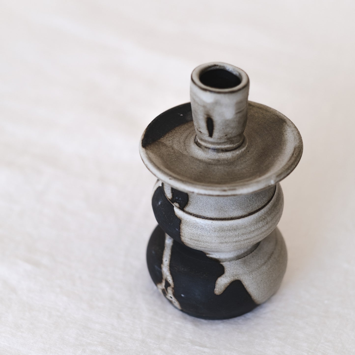 Beautiful pottery candle holder in earthy tones with rustic wabi sabi home